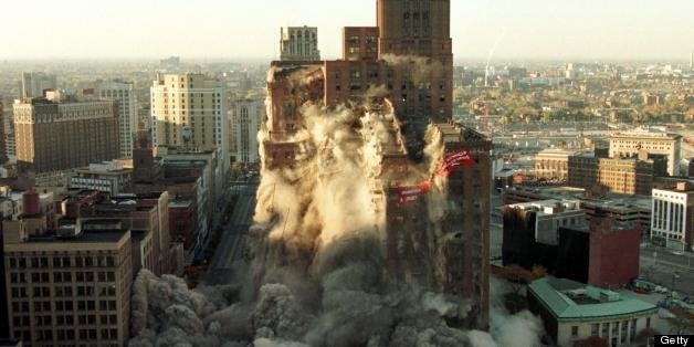 DETROIT, UNITED STATES: The J.L. Hudson building in downtown Detroit is imploded 24 October using 2,728 pounds of exposives making it the tallest and biggest building ever to be imploded. With 2.2 million square feet standing at 410 feet, 25 floors and four basements, the remaining 660 million pounds of rubble will take between five and six months to haul away. AFP PHOTO/Jeff KOWALSKY (Photo credit should read JEFF KOWALSKY/AFP/Getty Images)