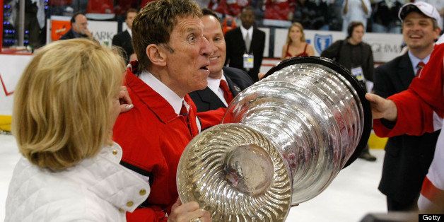 PITTSBURGH - JUNE 04: Owner Mike Ilitch of the Detroit Red Wings celebrates with the Stanley Cup after defeating the Pittsburgh Penguins in game six of the 2008 NHL Stanley Cup Finals at Mellon Arena on June 4, 2008 in Pittsburgh. Pennsylvania. The Red Wings defeated the Penguins 3-2 to win the Stanley Cup Finals 4 games to 2. (Photo by Dave Sandford/Getty Images)
