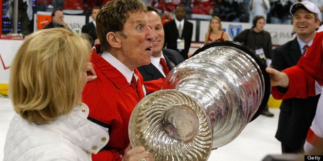 PITTSBURGH - JUNE 04: Owner Mike Ilitch of the Detroit Red Wings celebrates with the Stanley Cup after defeating the Pittsbu