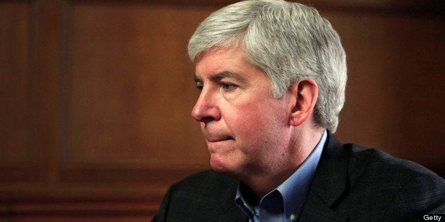 DETROIT, MI - MARCH 1: Michigan Governor Rick Snyder talks with the news media after announcing that he will appoint an Emergency Financial Manager for the city of Detroit during a town hall meeting at Wayne State University March 1, 2013 in Detroit, Michigan. Detroit has more than $14 billion in debts and liabilities. The City has 10 days to appeal Gov. Snyder's decision. (Photo by Bill Pugliano/Getty Images)