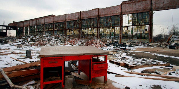 DETROIT, MI- DECEMBER 13: A desk remains at the abandoned Packard Automotive Plant December 13, 2013 in Detroit, Michigan. Peru-based developer Fernando Palazuelo made his final payment on the Packard Plant, which he won during a Wayne County auction for $405,000. Palazuelo plans on developing the former automotive plant where luxury Packard cars were made in the coming years. (Photo by Joshua Lott/Getty Images)