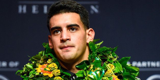 NEW YORK, NY - DECEMBER 13: Oregon Ducks quarterback Marcus Mariota speaks to the media during a press conference after the 2014 Heisman Trophy presentation at the New York Marriott Marquis on December 13, 2014 in New York City. (Photo by Alex Goodlett/Getty Images)