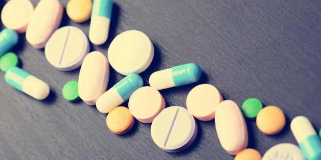 Pharmacy background on a black table. Tablets on a black background. Pills. Medicine and healthy. Close up of capsules.