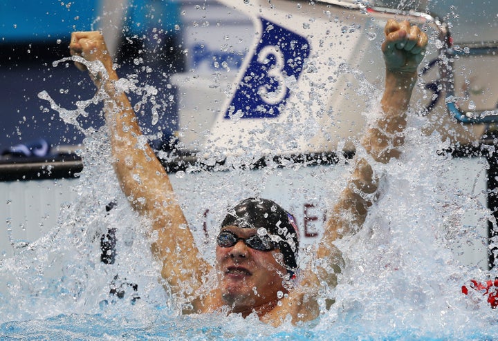 LONDON, ENGLAND - SEPTEMBER 04: Lantz Lamback of the United States celebrates after winning the gold in the Men's 50m Freestyle - S7 final on day 6 of the London 2012 Paralympic Games at Aquatics Centre on September 4, 2012 in London, England. (Photo by Clive Rose/Getty Images)