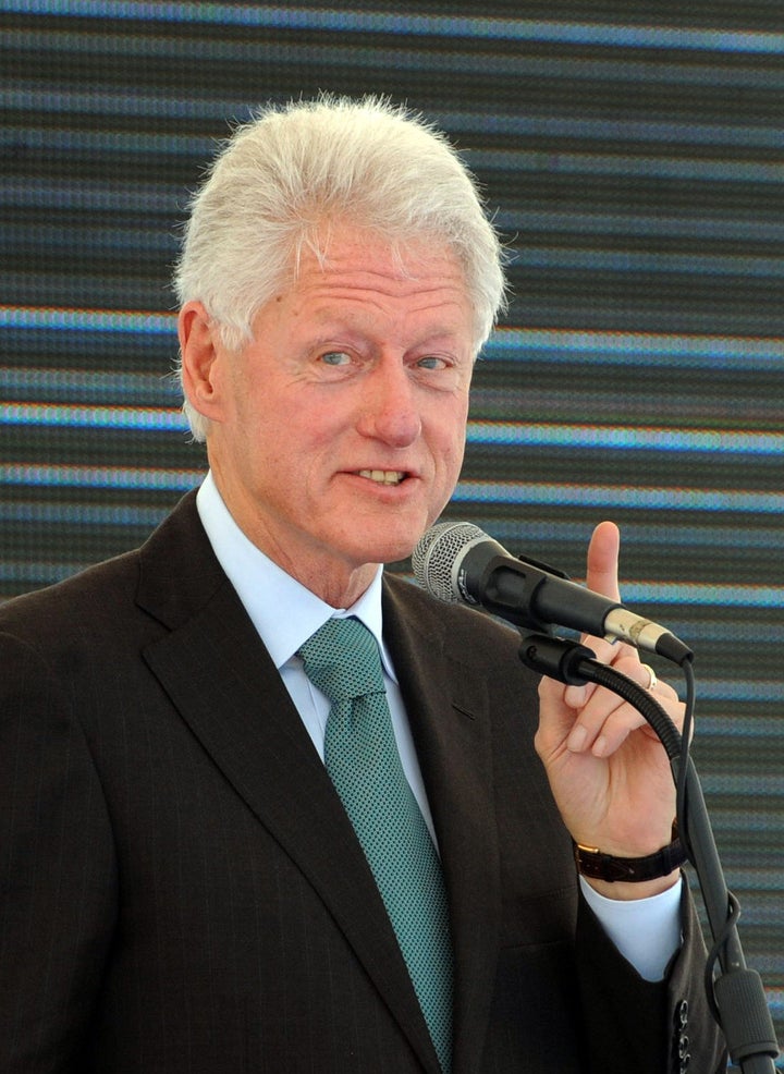 Former US President Bill Clinton speaks on February 21, 2013 during the inauguration ceremony for the first phase of the Eko Atlantic real estate project, in Lagos, Nigeria. Eko Atlantic or Eko Atlantic City is a planned district of Lagos, Nigeria, being constructed on land reclaimed from the Atlantic Ocean. It will house some 250,000 people and be a workplace for another 150,000. AFP PHOTO / PIUS UTOMI EKPEI (Photo credit should read PIUS UTOMI EKPEI/AFP/Getty Images)