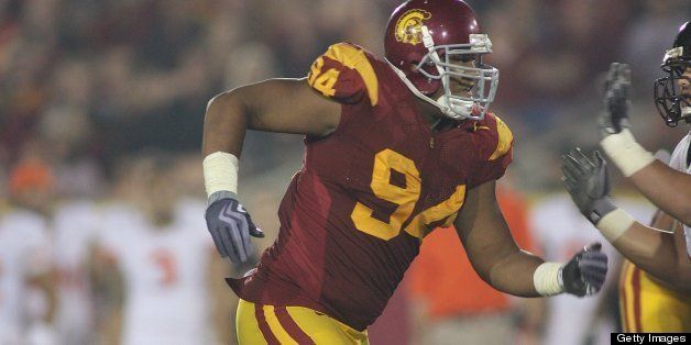 LOS ANGELES, CA - OCTOBER 24: Armond Armstead #94 of the USC Trojans rushes against the Oregon State Beavers on October 24, 2009 at the Los Angeles Coliseum in Los Angeles, California. USC won 42-36. (Photo by Jeff Golden/Getty Images)