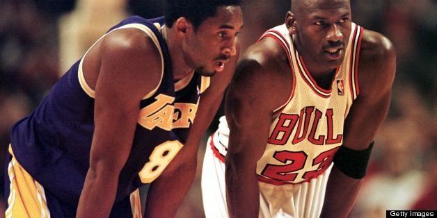 CHICAGO, UNITED STATES: Los Angeles Lakers guard Kobe Bryant(L) and Chicago Bulls guard Michael Jordan(R) talk during a free-throw attempt during the fourth quarter 17 December at the United Center in Chicago. Bryant, who is 19 and bypassed college basketball to play in the NBA, scored a team-high 33 points off the bench, and Jordan scored a team-high 36 points. The Bulls defeated the Lakers 104-83. AFP PHOTO VINCENT LAFORET (Photo credit should read VINCENT LAFORET/AFP/Getty Images)
