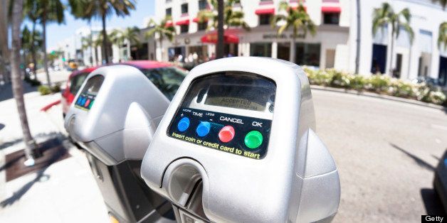 Parking meters on Rodeo Drive in a famous Beverly Hills fashion shopping destination.