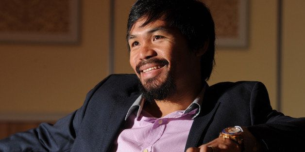 Philippine boxing icon Manny Pacquiao speaks during an AFP interview in Macau on July 27, 2013. Pacquiao will take on Brendon Rios in a welterweight bout in Macau on November 24. AFP PHOTO / Dale de la Rey (Photo credit should read DALE de la REY/AFP/Getty Images)