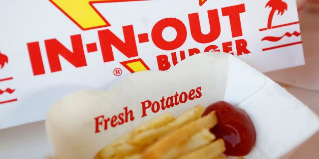 French fries with ketchup are arranged for a photograph at an In-N-Out Burger restaurant in Costa Mesa, California, U.S., on Wednesday, Feb. 6, 2013. In-N-Out, with almost 280 units in five states, is valued at about $1.1 billion based on the average price-to-earnings, according to the Bloomberg Billionaires Index. Photographer: Patrick T. Fallon/Bloomberg via Getty Images