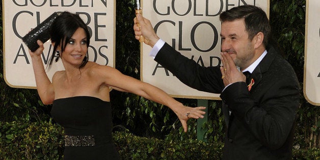 Courteney Cox, left, and David Arquette arrives at the at the 67th Golden Globes Awards January 17, 2010, in Beverly Hills, California. The awards are presented by the Hollywood Foreign Press Association. AFP PHOTOS / TIMOTHY A. CLARY (Photo credit should read TIMOTHY A. CLARY/AFP/Getty Images)