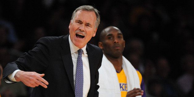 LOS ANGELES, CA - DECEMBER 10: Head coach Mike D'Antoni of the Los Angeles Lakers reacts during the game against the Phoenix Suns at Staples Center on December 10, 2013 in Los Angeles, California. NOTE TO USER: User expressly acknowledges and agrees that, by downloading and or using this photograph, User is consenting to the terms and conditions of the Getty Images License Agreement. (Photo by Lisa Blumenfeld/Getty Images)