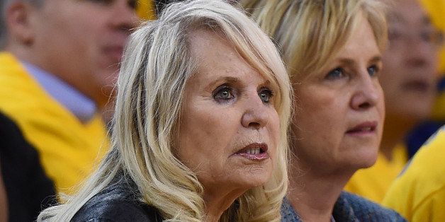 OAKLAND, CA - APRIL 27: Shelly Sterling, the wife of Donald Sterling owner of the Los Angeles Clippers, watches the Clippers against the Golden State Warriors in Game Four of the Western Conference Quarterfinals during the 2014 NBA Playoffs at ORACLE Arena on April 27, 2014 in Oakland, California. The players wore theirs warm up this way in protest of owner Donald Sterling's racially insensitive remarks. NOTE TO USER: User expressly acknowledges and agrees that, by downloading and or using this photograph, User is consenting to the terms and conditions of the Getty Images License Agreement. (Photo by Thearon W. Henderson/Getty Images)