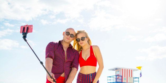 Pretty Couple using selfie stick, Miami Beach