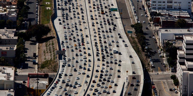 Vehicles sit in rush hour traffic on the Interstate 405 freeway in this aerial photograph taken over the Westwood neighborhoo