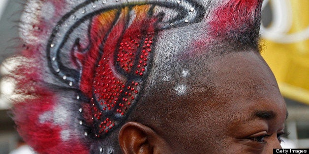 Gasmy Joseph shows off his white-hot Heat Mohawk before the start of Game 6 of the NBA Finals between the Miami Heat and the Dallas Mavericks at the AmericanAirlines Arena in Miami, Florida, Sunday, June 12, 2011. (Al Diaz/Miami Herald/MCT via Getty Images)