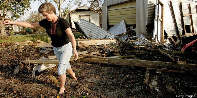 CHOKOLOSKEE, FL - OCTOBER 24: Martha Daniels surveys damage to a storage shed on her property as a result of Hurricane Wilma, which hit earlier in the morning, October 24, 2005 in Chokoloskee, Florida. Wilma slammed into the South Florida coastline as a strong Category 3 hurricane. (Photo by Carlo Allegri/Getty Images)