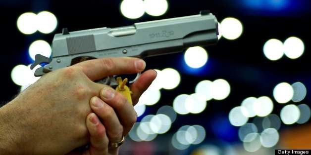 A convention goer handles a Ruger 1911 model semi-automatic pistol during the142nd annual National Rifle Association(NRA) convention at the George R. Brown Convention Center May 4, 2013 in Houston, Texas. AFP PHOTO / Karen BLEIER (Photo credit should read KAREN BLEIER/AFP/Getty Images)