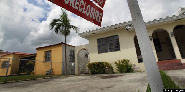 MIAMI - SEPTEMBER 16: A pre-foreclosure sign is seen in front of a home on September 16, 2010 in Miami, Florida. RealtyTrac, an online marketplace for foreclosure properties, released its U.S. Foreclosure Market Report for August 2010, which shows foreclosure filings - default notices, scheduled auctions and bank repossessions - were reported on 338,836 properties in August, a 4 percent increase from the previous month. (Photo by Joe Raedle/Getty Images)