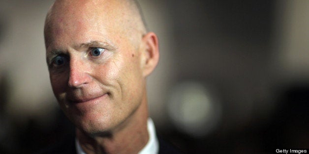 MIAMI, FL - MAY 28: Florida Governor Rick Scott speaks to the media after signing Florida Senate Bill 52, legislation to ban