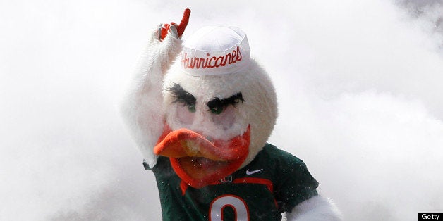 MIAMI GARDENS, FL - APRIL 13: The Miami Hurricanes mascot 'Sebastian the ibis' leads the players through the smoke for their