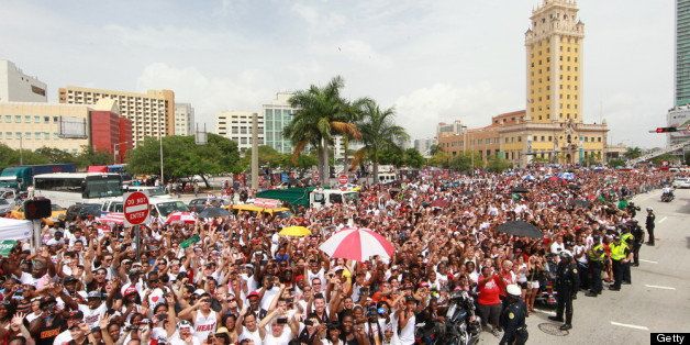 MIAMI, FL - JUNE 25: Fans of the Miami Heat crowd the streets during the victory parade for the 2012 NBA Champion Miami Heat on June 25, 2012 at the American Airlines Arena in Miami, Florida. NOTE TO USER: User expressly acknowledges and agrees that, by downloading and or using this photograph, User is consenting to the terms and conditions of the Getty Images License Agreement. Mandatory Copyright Notice: Copyright 2012 NBAE (Photo by Joe Murphy/NBAE via Getty Images)