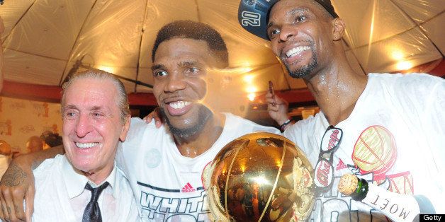 MIAMI, FL - JUNE 20: Pat Riley, Udonis Haslem #40 and Chris Bosh #1 of the Miami Heat pose for a photo while celebrating after defeating the San Antonio Spurs in Game Seven of the 2013 NBA Finals and being named the 2013 NBA Champions on June 20, 2013 at the American Airlines Arena in Miami, Florida. NOTE TO USER: User expressly acknowledges and agrees that, by downloading and or using this photograph, User is consenting to the terms and conditions of the Getty Images License Agreement. Mandatory Copyright Notice: Copyright 2013 NBAE (Photo by Andrew D. Bernstein/NBAE via Getty Images)