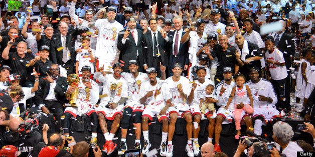 MIAMI, FL - JUNE 20: Miami Heat players and staff celebrate following their team's Championship victory against the San Antonio Spurs in Game Seven of the 2013 NBA Finals on June 20, 2013 at American Airlines Arena in Miami, Florida. NOTE TO USER: User expressly acknowledges and agrees that, by downloading and or using this photograph, User is consenting to the terms and conditions of the Getty Images License Agreement. Mandatory Copyright Notice: Copyright 2013 NBAE (Photo by Jesse D. Garrabrant/NBAE via Getty Images)