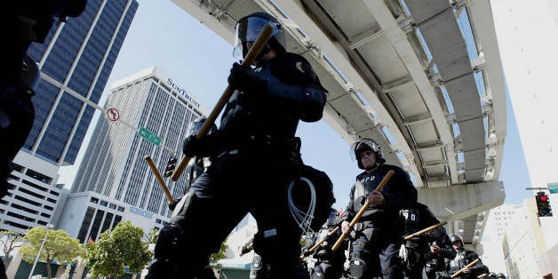 MIAMI, UNITED STATES: Miami Police march toward a staging area near where the Free Trade Area of the Americas ministerial m
