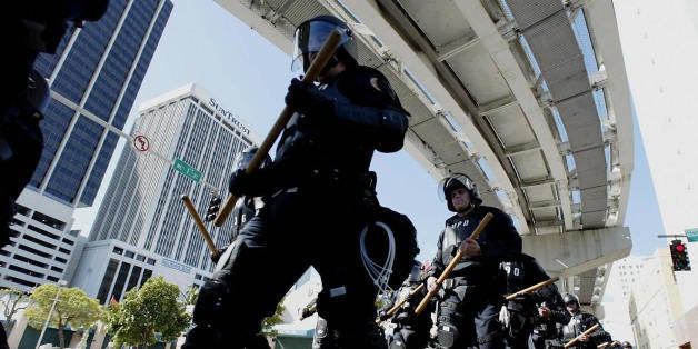 MIAMI, UNITED STATES: Miami Police march toward a staging area near where the Free Trade Area of the Americas ministerial meetings were held at the Intercontinental Hotel. 21 November 2003 in Miami, Florida. Thousand of protestors were expected as negotiators from 34 nations are working toward an accord that would create a Free Trade Area for the Americas. AFP PHOTO/Stephen JAFFE (Photo credit should read STEPHEN JAFFE/AFP/Getty Images)