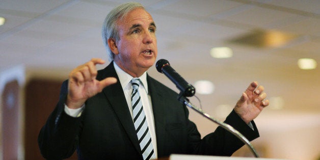 MIAMI, FL - AUGUST 21: Miami-Dade County Mayor Carlos A. Gimenez speaks to the media regarding the U.S. Justice Department and state attorneys general suit against the American Airlines and US Airways merger on August 21, 2013 in Miami, Florida. The Mayor and Miami International Airport Aviation Director Emilio T. González addressed the letter they sent Attorney General Eric H. Holder, Jr. in which they stated their concerns with the review of the merger due to the damage it will do to the local economy if the merger isn't allowed to go through. (Photo by Joe Raedle/Getty Images)