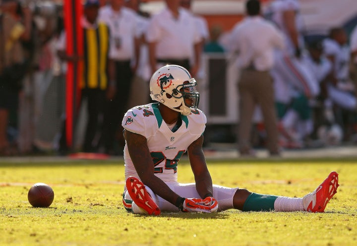 MIAMI GARDENS, FL - NOVEMBER 11: Sean Smith #24 of the Miami Dolphins rects to missing an interception during a game against