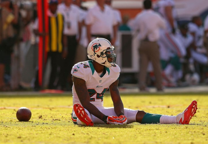 MIAMI GARDENS, FL - NOVEMBER 11: Sean Smith #24 of the Miami Dolphins rects to missing an interception during a game against the Tennessee Titans at Sun Life Stadium on November 11, 2012 in Miami Gardens, Florida. (Photo by Mike Ehrmann/Getty Images)