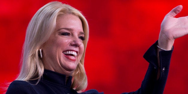 UNITED STATES - AUGUST 29: State Attorneys General Pam Bondi, Fla., and Sam Olens, Ga., address the Republican National Convention in the Tampa Bay Times Forum on the night Rep. Paul Ryan, R-Wisc., republican vice-presidential nominee, delivered a speech to the crowd. (Photo By Tom Williams/CQ Roll Call)