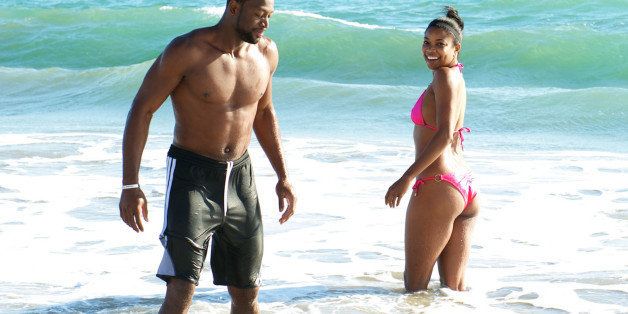 MALIBU, CA - SEPTEMBER 21: (EXCLUSIVE COVERAGE) Miami Heat basketball player Dwyane Wade and actress Gabrielle Union are sighted enjoying a beach outing on September 21, 2013 in Malibu, California. (Photo by Bobby Metelus/Getty Images)