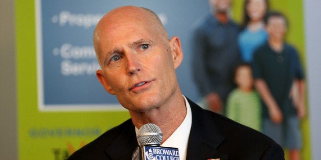 FORT LAUDERDALE, FL - SEPTEMBER 10: Florida Governor Rick Scott speaks at a meeting with business leaders and other politicians as he kicks off what he is calling, 'It's Your Money' tax cut tour on September 10, 2013 in Fort Lauderdale, Florida. The Governor is putting together a plan to cut taxes and fees for Florida families by $500 million in the next proposed budget. (Photo by Joe Raedle/Getty Images)