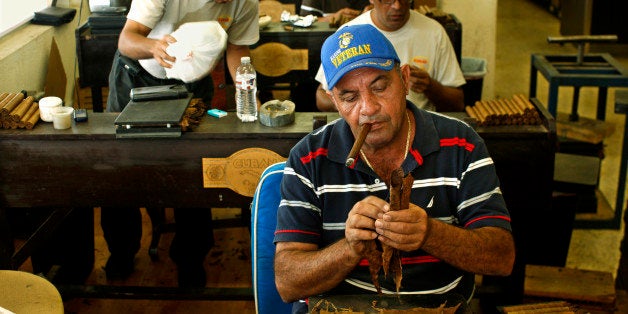 Cigar Roller Smoking a Cigar, Cuban Crafters, Miami (Photo by Hoberman Collection/UIG via Getty Images)