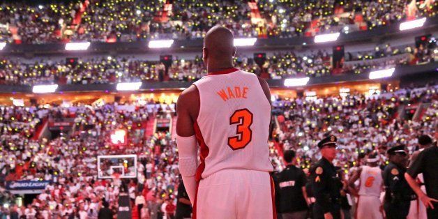 The Miami Heat's Dwyane Wade takes the court for the start of the regular season as the Heat plays host to the Chicago Bulls at AmericanAirlines Arena in Miami, Florida, on Tuesday, October 29, 2013. (Al Diaz/Miami Herald/MCT via Getty Images)