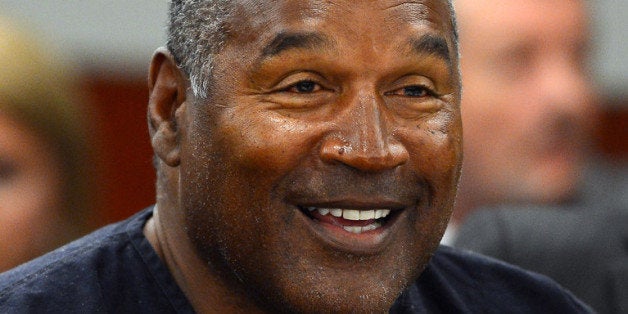 LAS VEGAS, NV - MAY 17: O.J. Simpson smiles during an evidentiary hearing in Clark County District Court on May 17, 2013 in Las Vegas, Nevada. Simpson, who is currently serving a nine-to-33-year sentence in state prison as a result of his October 2008 conviction for armed robbery and kidnapping charges, is using a writ of habeas corpus to seek a new trial, claiming he had such bad representation that his conviction should be reversed. (Photo by Ethan Miller/Getty Images)