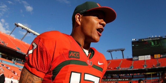 MIAMI GARDENS, FL - NOVEMBER 23: Stephen Morris #17 of the Miami Hurricanes walks off the field following a game against the Virginia Cavaliers at Sun Life Stadium on November 23, 2013 in Miami Gardens, Florida. (Photo by Mike Ehrmann/Getty Images)