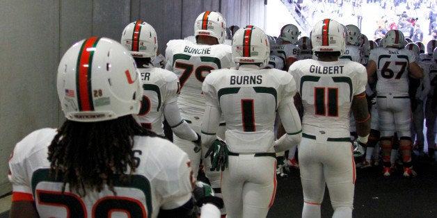 PITTSBURGH, PA - NOVEMBER 29: The Miami Hurricanes take the field against the Pittsburgh Panthers on November 29, 2013 at He