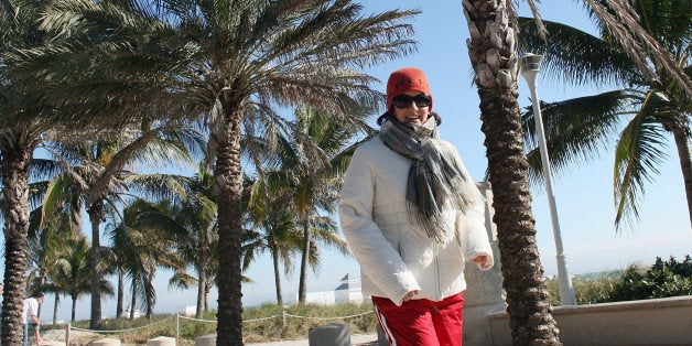 MIAMI BEACH, FL - JANUARY 11: A runner bundles up as she excises on the boardwalk next to the beach on January 11, 2010 in Miami Beach, Florida. The National Weather Service said it recorded 36 degrees in Miami Monday morning, which beat the 82-year-old record of 37 degrees. (Photo by Joe Raedle/Getty Images)