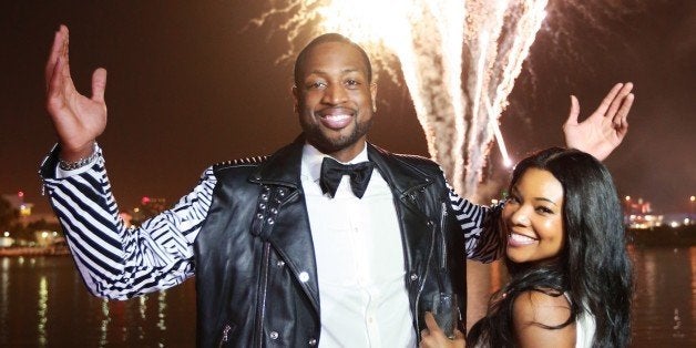 MIAMI BEACH, FL - JANUARY 11: (EXCLUSIVE COVERAGE) Dwyane Wade and Gabrielle Union enjoy the fireworks display at Dwyane Wades 'Rock The Boat' 32nd Birthday Party on January 11, 2014 in Miami Beach, Florida. (Photo by Bobby Metelus/Getty Images)