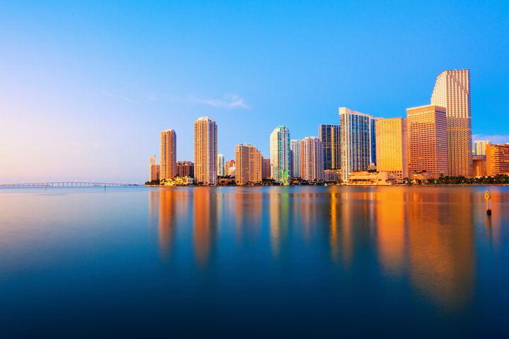 The skyscrapers of Downtown Miami reflected in the bay.