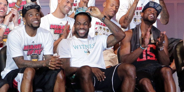 MIAMI, FL - JUNE 24: (L-R) Udonis Haslem, LeBron James and Dwyane Wade of the Miami Heat attend their NBA Championship victo