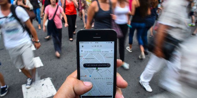 BARCELONA, SPAIN - JULY 01: In this photo illustration the new smart phone taxi app 'Uber' shows how to select a pick up location at Plaza de Catalunya square on July 1, 2014 in Barcelona, Spain. Taxi drivers in various cities have been on strike over unlicensed car-hailing services. Drivers say that there is a lack of regulation behind the new app. (Photo by David Ramos/Getty Images)