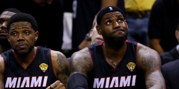 SAN ANTONIO, TX - JUNE 15: LeBron James #6 of the Miami Heat reacts on the bench against the San Antonio Spurs during Game F