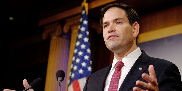 WASHINGTON, DC - DECEMBER 17: Sen. Marco Rubio (R-FL) reacts to U.S. President Barack Obama's announcement about revising policies on U.S.-Cuba relations on December 17, 2014 in Washington, DC. Rubio called the President a bad negotiator and criticized what he claimed was a deal with no democratic advances for Cuba. (Photo by T.J. Kirkpatrick/Getty Images)