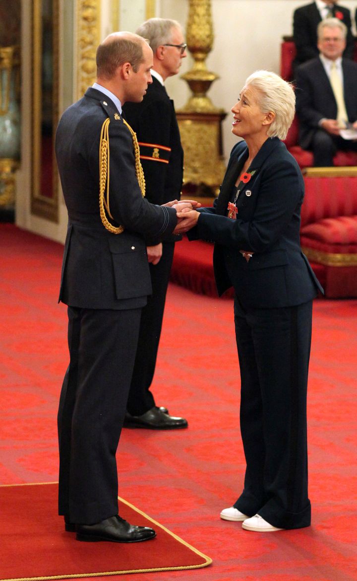 Emma Thompson receives Britain's highest honor at Buckingham Palace on Wednesday. 