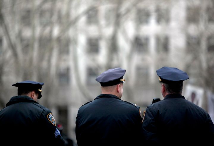 NEW YORK, NY - MARCH 18: New York CIty Police officers stand near a demonstration against the city's 'stop and frisk' searches in lower Manhattan near Federal Court March 18, 2013 in New York City. Hearings in a federal lawsuit filed by four black men against the city police department's 'stop and frisk' searches starts today in Manhattan Federal Court. (Photo by Allison Joyce/Getty Images)